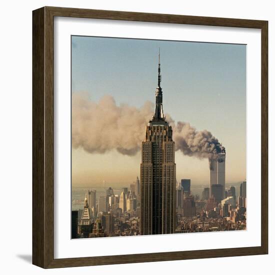 Twin Towers of the World Trade Center Burn Behind the Empire State Buildiing, September 11, 2001-null-Framed Photographic Print