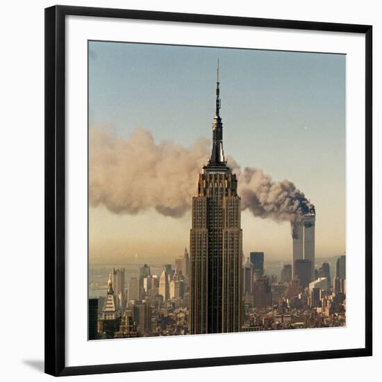 Twin Towers of the World Trade Center Burn Behind the Empire State Buildiing, September 11, 2001-null-Framed Photographic Print