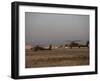 Two AH-64 Apache Helicopters Prepare for Takeoff-Stocktrek Images-Framed Photographic Print