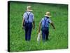 Two Amish Boys Walk with Their Golf Clubs Through a Field of Soy Beans-null-Stretched Canvas