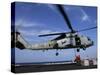 Two Aviation Ordnancemen Connect Transport Cables to a SH-60B Helicopter-Stocktrek Images-Stretched Canvas