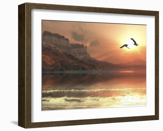 Two Bald Eagles Fly Along a Mountainous Coastline at Sunset-Stocktrek Images-Framed Photographic Print