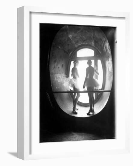 Two Ballerinas Standing in Window of the Paris Opera During Rehearsal of "Swan Lake"-Alfred Eisenstaedt-Framed Photographic Print