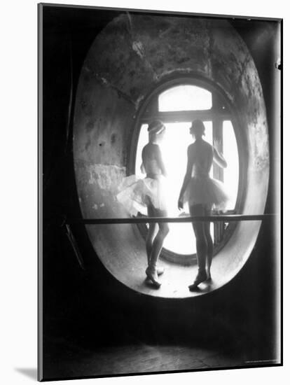 Two Ballerinas Standing in Window of the Paris Opera During Rehearsal of "Swan Lake"-Alfred Eisenstaedt-Mounted Photographic Print