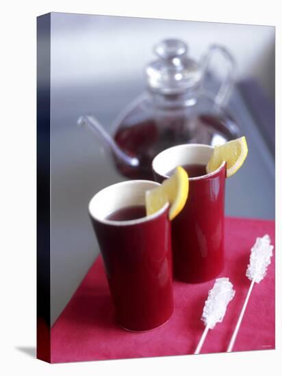 Two Beakers of Fruit Tea with Lemon Wedges, Sugar Sticks-Anita Oberhauser-Stretched Canvas