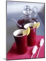 Two Beakers of Fruit Tea with Lemon Wedges, Sugar Sticks-Anita Oberhauser-Mounted Photographic Print