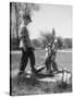 Two Boys Getting Water from a Pump at Rural School-Thomas D^ Mcavoy-Stretched Canvas