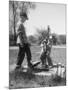 Two Boys Getting Water from a Pump at Rural School-Thomas D^ Mcavoy-Mounted Photographic Print