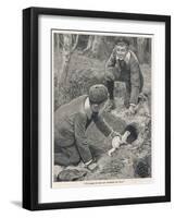 Two Boys in Caps Set a Ferret Down a Rabbit Hole-null-Framed Art Print