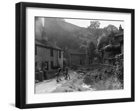Two boys out on their bicycles near a stream in the Peak District-Staff-Framed Photographic Print