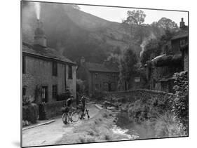 Two boys out on their bicycles near a stream in the Peak District-Staff-Mounted Photographic Print