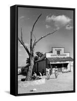 Two Boys Playing Nr. a Dead Tree as Judge Roy Langrty and a Man Walk Past a General Store-Alfred Eisenstaedt-Framed Stretched Canvas