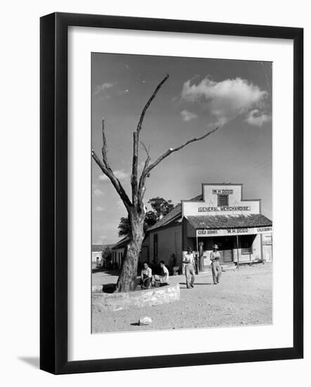 Two Boys Playing Nr. a Dead Tree as Judge Roy Langrty and a Man Walk Past a General Store-Alfred Eisenstaedt-Framed Photographic Print