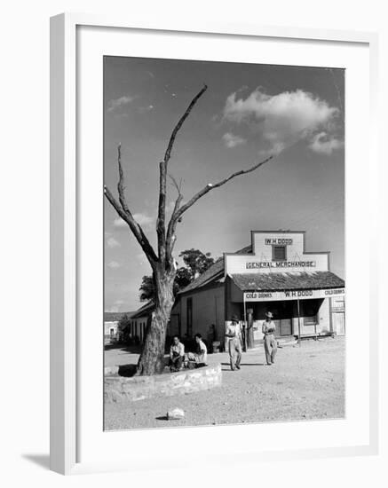 Two Boys Playing Nr. a Dead Tree as Judge Roy Langrty and a Man Walk Past a General Store-Alfred Eisenstaedt-Framed Photographic Print