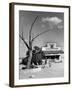 Two Boys Playing Nr. a Dead Tree as Judge Roy Langrty and a Man Walk Past a General Store-Alfred Eisenstaedt-Framed Photographic Print