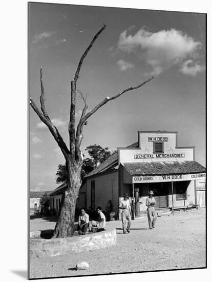 Two Boys Playing Nr. a Dead Tree as Judge Roy Langrty and a Man Walk Past a General Store-Alfred Eisenstaedt-Mounted Photographic Print