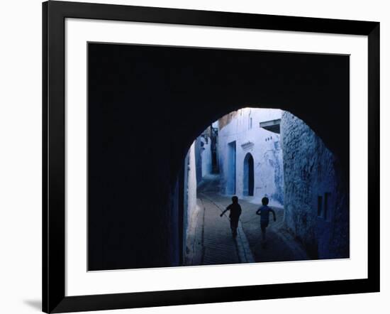 Two Boys Running Through Kasbah, Chefchaouen, Morocco-Jeffrey Becom-Framed Photographic Print