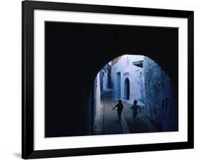 Two Boys Running Through Kasbah, Chefchaouen, Morocco-Jeffrey Becom-Framed Photographic Print