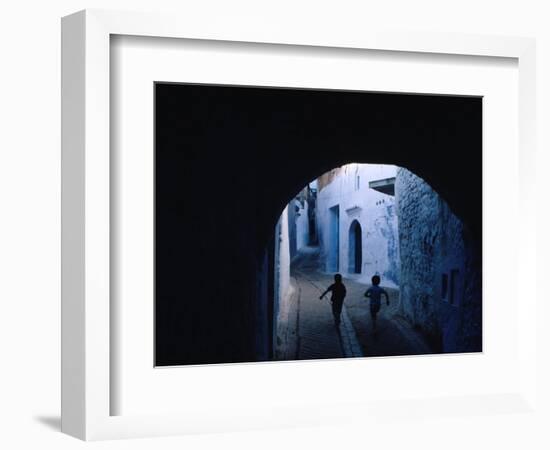 Two Boys Running Through Kasbah, Chefchaouen, Morocco-Jeffrey Becom-Framed Photographic Print