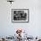 Two Boys Sit for a Game of Chess. Eight Spectators Look On-null-Framed Photographic Print displayed on a wall