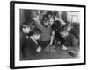 Two Boys Sit for a Game of Chess. Eight Spectators Look On-null-Framed Photographic Print