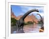 Two Brachiosaurus Dinosaurs in Water Next to Red Rock Mountains-null-Framed Art Print