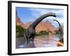 Two Brachiosaurus Dinosaurs in Water Next to Red Rock Mountains-null-Framed Art Print