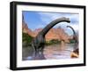 Two Brachiosaurus Dinosaurs in Water Next to Red Rock Mountains-null-Framed Art Print