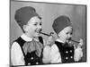 Two Brothers in Bavarian Costumes Pretend to Smoke Pipes, Ca. 1947-null-Mounted Photographic Print