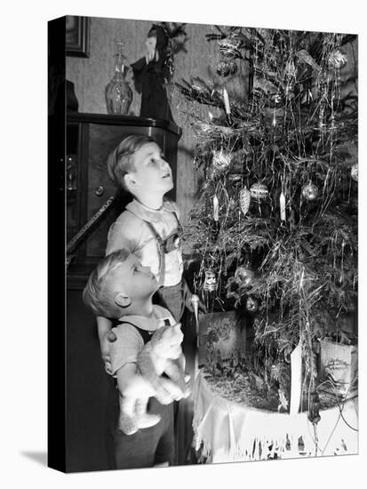 Two Brothers Look at a Christmas Tree in their Living Room in Germany, Ca. 1949-null-Stretched Canvas