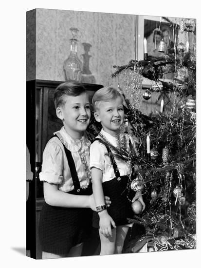 Two Brothers Look at a Christmas Tree in their Living Room in Germany, Ca. 1949-null-Stretched Canvas