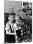 Two Brothers Look at a Christmas Tree in their Living Room in Germany, Ca. 1949-null-Mounted Photographic Print