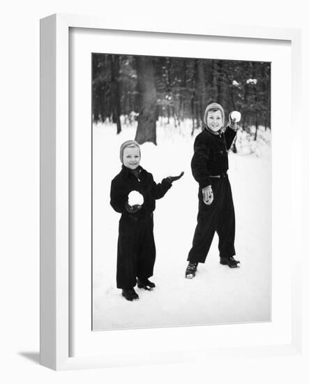 Two Brothers Play in the Snow, Ca. 1950-null-Framed Photographic Print