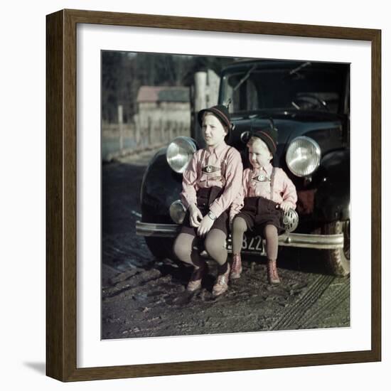 Two Brothers Sit on the Bumper of the Family Mercedes Benz in Germany, Ca. 1949-null-Framed Photographic Print