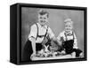 Two Brothers Sit with Easter Decorations, Ca. 1948-null-Framed Stretched Canvas