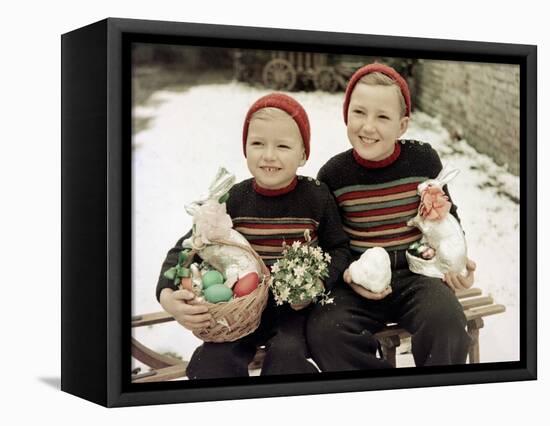 Two Brothers Sit with Easter Decorations Outside in Germany, Ca. 1948-null-Framed Stretched Canvas