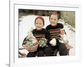 Two Brothers Sit with Easter Decorations Outside in Germany, Ca. 1948-null-Framed Photographic Print