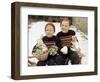 Two Brothers Sit with Easter Decorations Outside in Germany, Ca. 1948-null-Framed Photographic Print