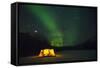 Two Campers Drinking a Bottle of Wine in a Tent under the Northern Lights-Jami Tarris-Framed Stretched Canvas