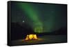 Two Campers Drinking a Bottle of Wine in a Tent under the Northern Lights-Jami Tarris-Framed Stretched Canvas