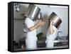 Two Chefs Having Discussion with Large Pans on their Heads-Robert Kneschke-Framed Stretched Canvas