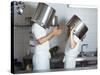 Two Chefs Having Discussion with Large Pans on their Heads-Robert Kneschke-Stretched Canvas