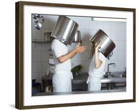 Two Chefs Having Discussion with Large Pans on their Heads-Robert Kneschke-Framed Photographic Print