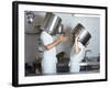 Two Chefs Having Discussion with Large Pans on their Heads-Robert Kneschke-Framed Photographic Print