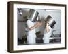 Two Chefs Having Discussion with Large Pans on their Heads-Robert Kneschke-Framed Photographic Print