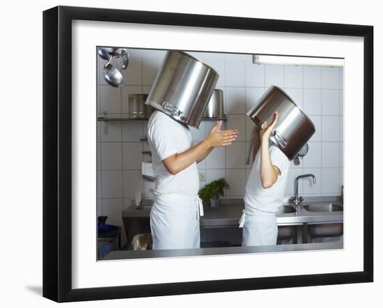 Two Chefs Having Discussion with Large Pans on their Heads-Robert Kneschke-Framed Photographic Print