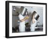 Two Chefs Having Discussion with Large Pans on their Heads-Robert Kneschke-Framed Photographic Print