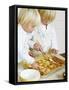 Two Children Brushing Biscuits with Glace Icing-Renate Forster-Framed Stretched Canvas