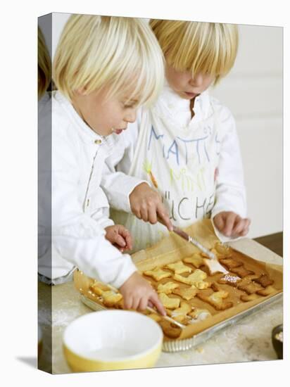 Two Children Brushing Biscuits with Glace Icing-Renate Forster-Stretched Canvas