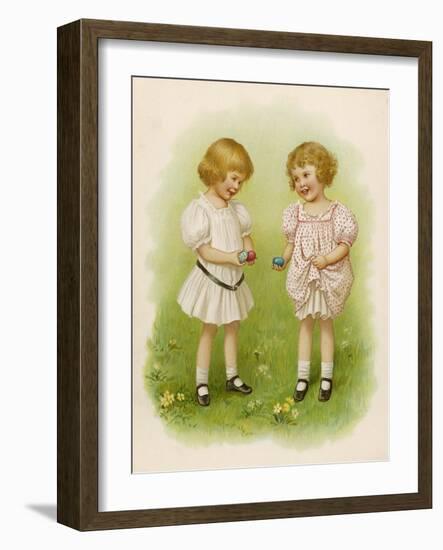 Two Children Compare Their Eggs on the Grass-Ida Waugh-Framed Art Print